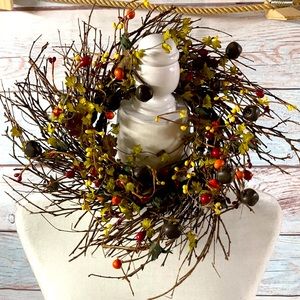 12 inch grape vine wreath. Bells and berries.